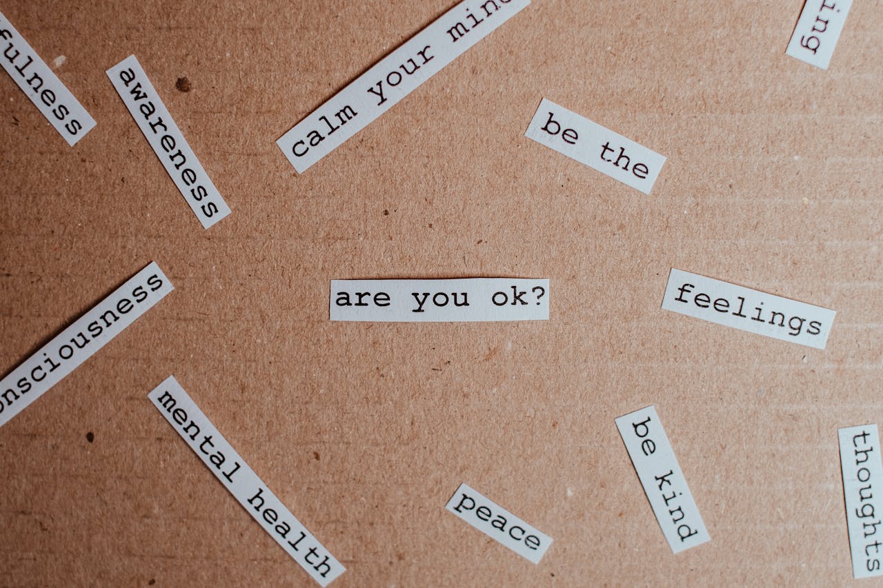 services-02 Cut-out words promoting mental health awareness on cardboard background.